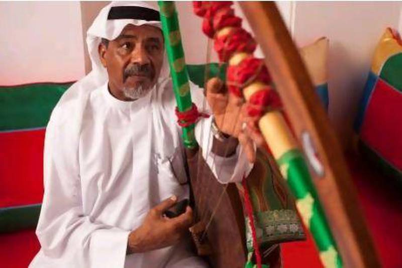 Taher Ismail, a retired army officer, plays his tambura at the Sharjah Directorate of Heritage majlis. Ismail has been playing since he was 10 and wishes more young people would learn the old instruments.