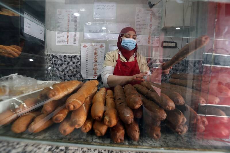 A baker sells bread in Tunis in March 2022. Cereal-based products have now disappeared from the shelves as a result of the war in Ukraine, the main wheat exporter to Tunisia. EPA