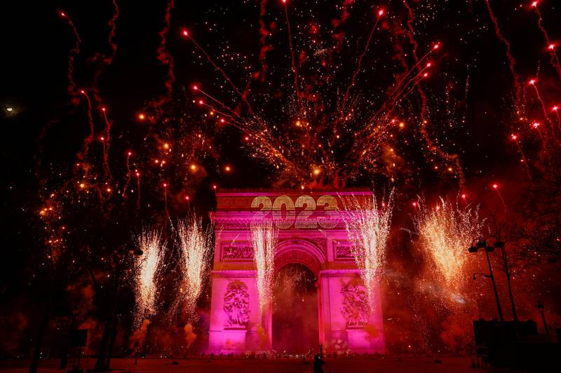 Fireworks illuminate the sky over the Arc de Triomphe during New Year's celebrations on the Champs Elysees avenue in Paris, on January 1, 2023. Reuters