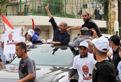 Opposition candidate Yassin Yassin gestures as he is greeted by supporters in Jeb Jennin, West Bekaa. Reuters