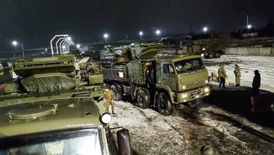 A Russian military vehicle drives off a railway platform after arriving in Belarus. AP Photo