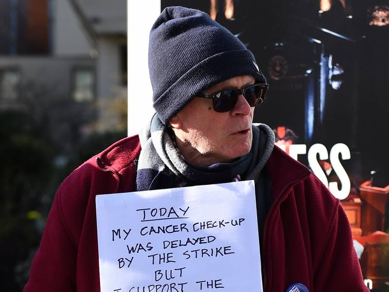 Cancer patient Phil Sutcliffe joined NHS junior doctors on the picket line outside St Thomas' Hospital in London. PA