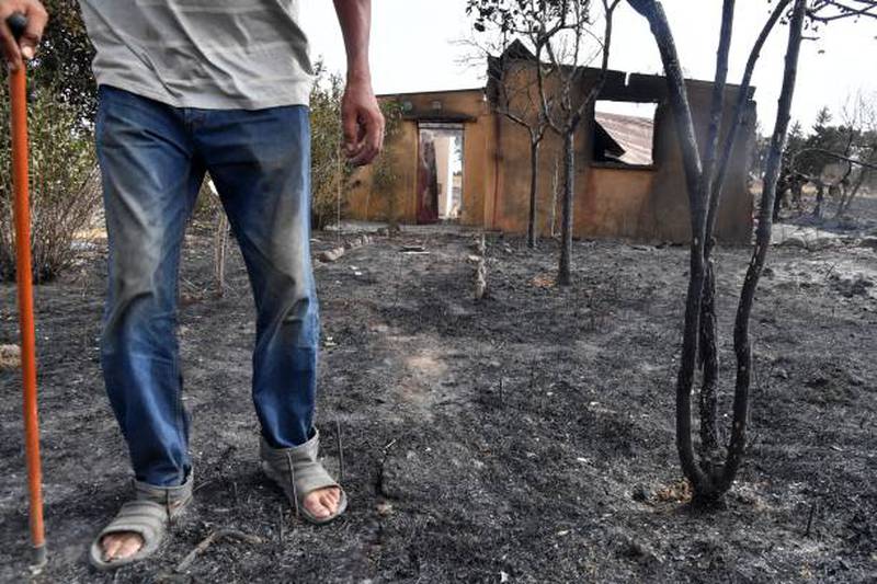This man's home was destroyed in El Kala. AFP