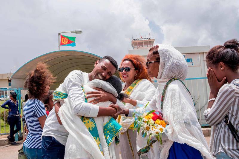 Medhane Berhane cries while meeting his mother and family at the Asmara International airport July 21, 2018 when he sets foot in the Eritrean capital Asmara for the first time in 18 years. Ethiopia and Eritrea resumed commercial airline flights on July 18, 2018 for the first time in two decades after resuming diplomatic ties after 20-year-stand off.  / AFP / Maheder HAILESELASSIE TADESE
