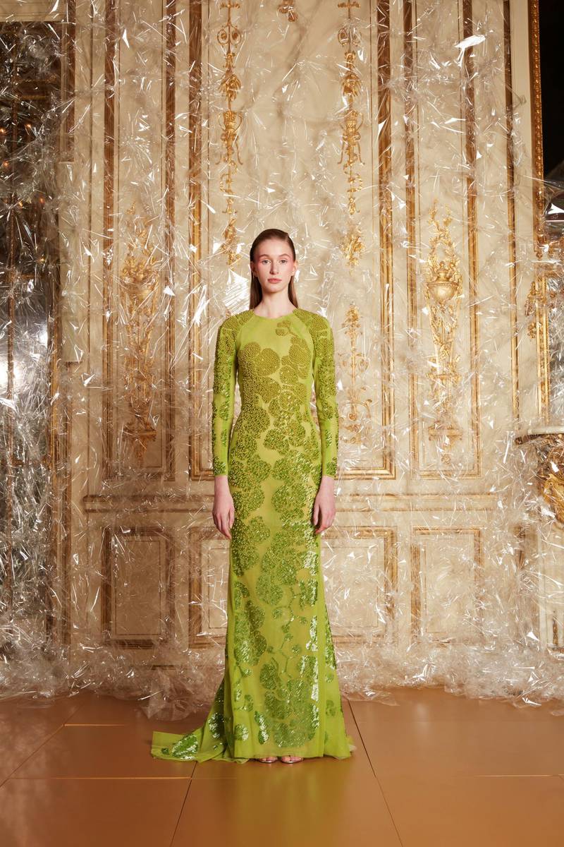 A sculpted bias green sleeved gown