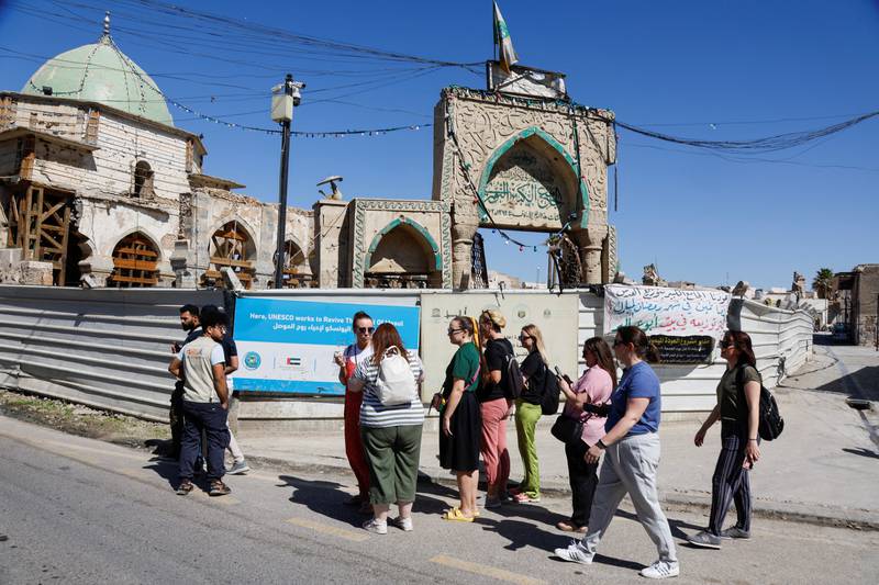 Foreign tourists visit Great Al-Nuri mosque after the city's liberation from the Islamic State (IS) group in 2017, in the Old City of Mosul, Iraq, April 21, 2022.  REUTERS / Khalid Al-Mousily