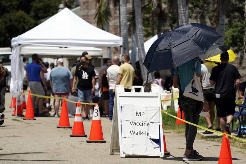 People queue a monkeypox vaccination site in California. AP
