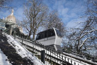 Snow near the funicular of Montmartre below the Sacre-Coeur Basilica in Paris, on February 8, 2018. AFP