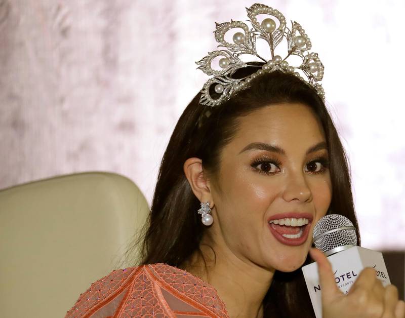 Miss Universe 2018 Catriona Gray answers questions during a news conference on her homecoming in suburban Quezon city, northeast of Manila, Philippines, Wednesday, Feb. 20, 2019, two months after winning the crown in Bangkok, Thailand. Gray, in describing herself before and after winning the title said she was "driven" to win the crown and now has a "responsibility" as a reigning beauty queen. (AP Photo/Bullit Marquez)
