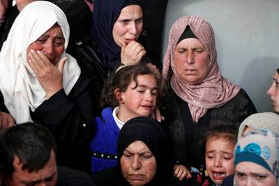 Relatives mourn during Mohammed Hamayel's funeral. Reuters