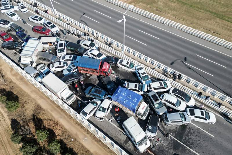 This aerial photo taken on December 28, 2022 shows a multi-vehicle collision on Zhengxin Yellow River Bridge in Zhengzhou, in China's central Henan province.  (Photo by AFP)  /  China OUT