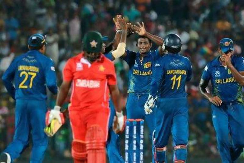 Ajantha Mendis, centre, returned from an eight-month injury lay-off with a six-wicket haul. Ishara S Kodikara / AFP