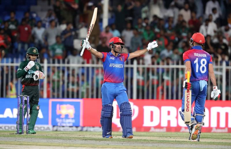 Afghanistan's Najibullah Zadran celebrates after hitting the winning runs against Bangladesh in the Asia Cup match at Sharjah Cricket Stadium on Tuesday, August 30, 2022. All images by Pawan Singh / The National
