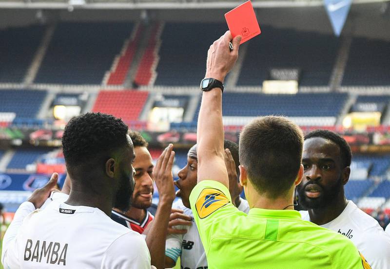 Referee Benoit Bastien shows a red card to PSG's Neymar and Lille defender Tiago Djalo during the Ligue 1 game - won 1-0 by Lille - on Saturday, April 3. AFP