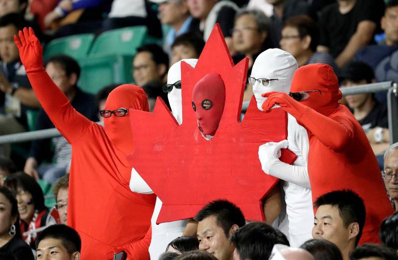 Canadian fans wave ahead of the Rugby World Cup Pool B game at Oita Stadium between New Zealand and Canada in Oita, Japan. AP Photo