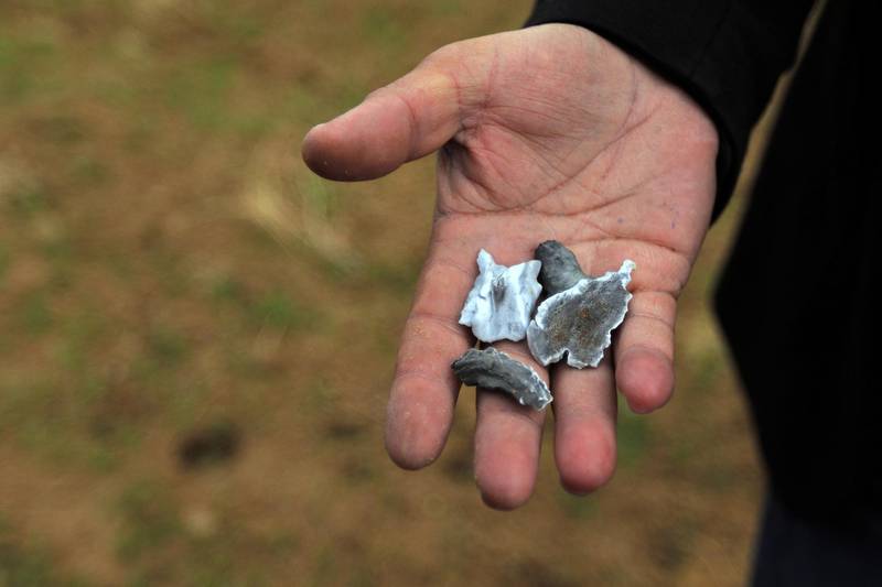 A man holds shrapnel from a missile launched by Iran on US-led coalition forces on the outskirts of Duhok, Iraq. Reuters