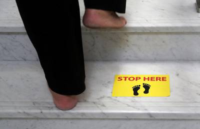 DUBAI, UNITED ARAB EMIRATES , June 30 – 2020 :- Safe distance marking stickers pasted on the floor at the Gurunanak Darbar in Jebel Ali in Dubai. Places of worship opening up tomorrow in the UAE. (Pawan Singh / The National) For News. Story by Ramola