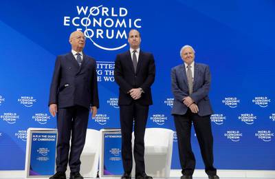 Klaus Schwab, founder and Executive Chairman of the World Economic Forum, the Duke of Cambridge, and Sir David Attenborough on stage. AP Photo