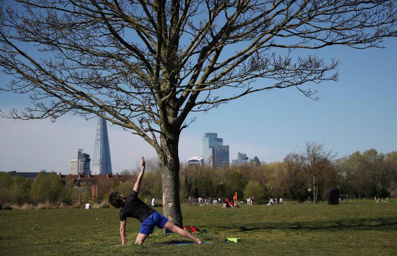 A man exercises in Burgess Park, as the spread of the coronavirus continues, in London, UK on April 5, 2020. Reuters