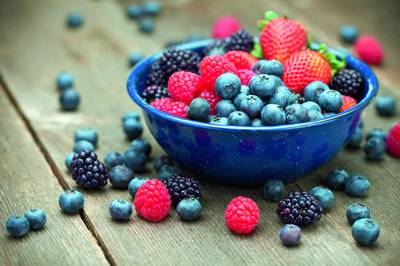 A bowlful of delicious organic berries.  Strawberries, blackberries, blueberries and raspberries. (iStockphoto.com)