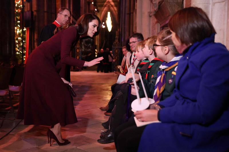 The Princess of Wales speaks with children at the Together at Christmas carol service on Thursday night. AFP