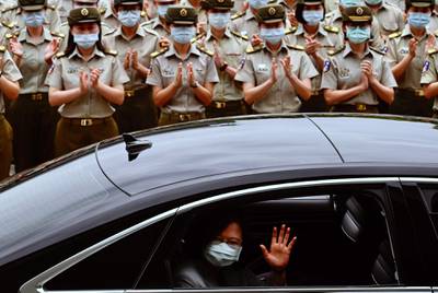 Taiwan President Tsai Ing-wen waves after inspecting the military police headquarters in Taipei.  AFP