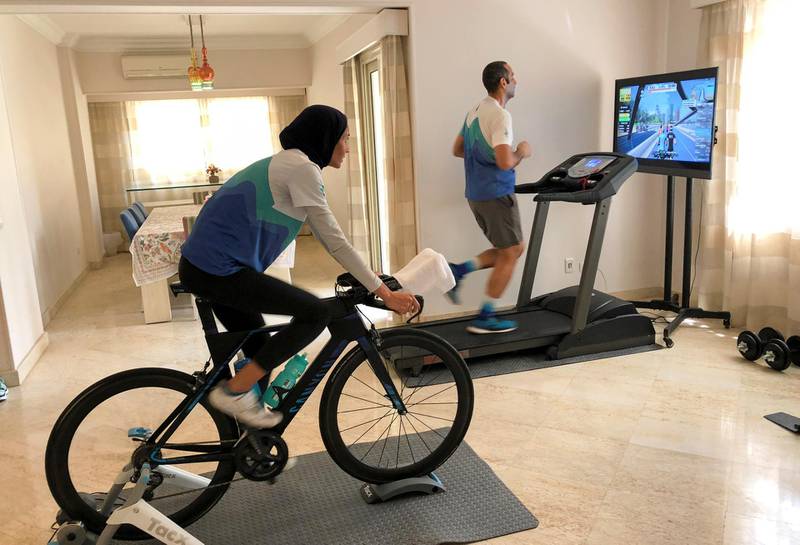 A husband and wife train at home during a self-imposed lockdown as Egypt ramps up efforts to slow the spread of the coronavirus, Cairo, Egypt, April 22. Sherif Fahmy / Reuters