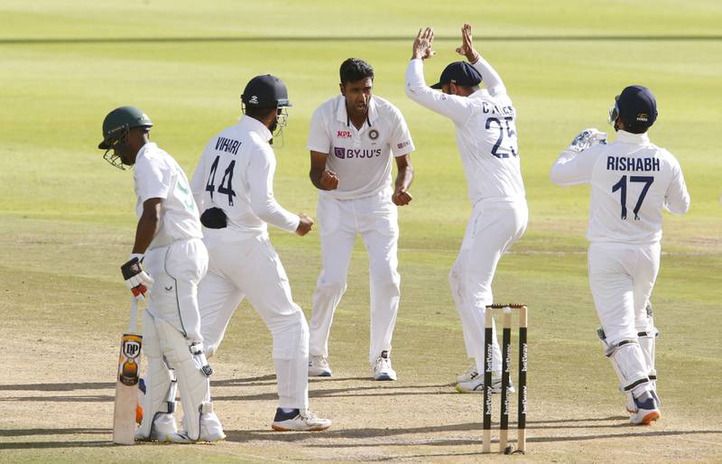 India's Ravichandran Ashwin celebrates with teammates after taking the wicket of South Africa batsman Keegan Petersen for 28. Reuters