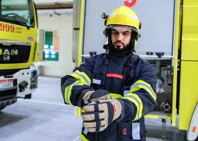 Abu Dhabi, United Arab Emirates, August 11, 2020.   Reporting from the Saadiyat Civil Defence station, action from their “state of the art” control , showcasing the latest technologies they have introduced to their fire engines.  --  Juma Saeed Al Nuaimi- 32, Warning Officer, suits up.Victor Besa /The NationalSection: NAReporter:  Haneen Dajani