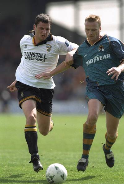 28 Apr 1997:  Geoff Thomas (right) of Wolverhampton Wanderers holds off a Port Vale player during the Nationwide Division One match against Port Vale at Port Vale in England. Wolverhampton Wanderers won 2-1. \ Mandatory Credit: Ben Radford /Allsport