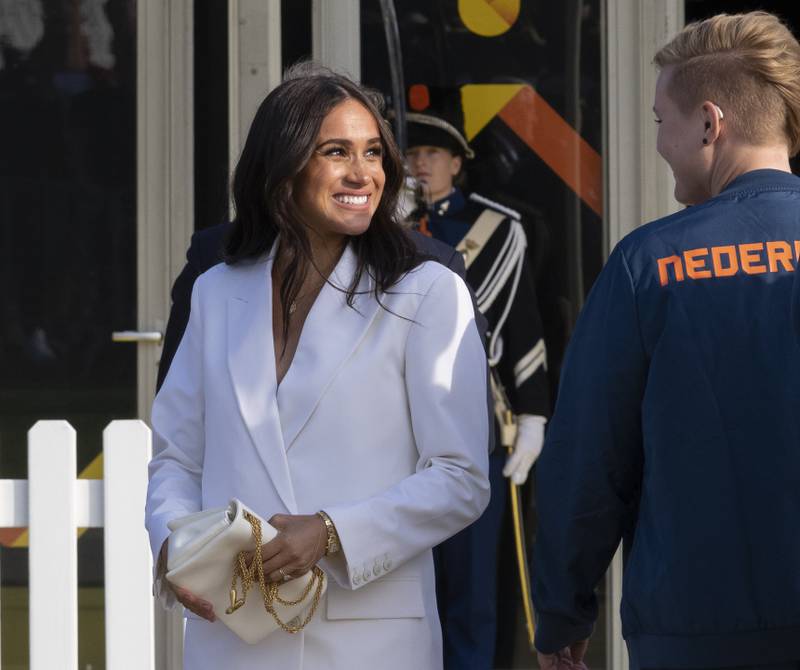 Meghan, Duchess of Sussex, arrives at the Invictus Games venue in The Hague, the Netherlands, in a white Valentino suit. AP
