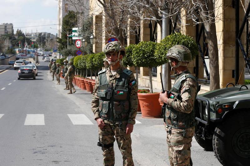 Jordanian soldiers stand guard outside a hotel that was transformed into a quarantine station amid concerns over the coronavirus in Amman, Jordan. Reuters