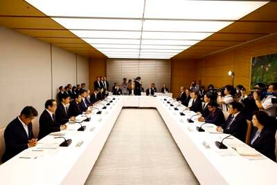 Japanese Prime Minister Fumio Kishida and ministers at a meeting in Tokyo to discuss releasing treated radioactive water from the Fukushima nuclear power plant into the sea. EPA