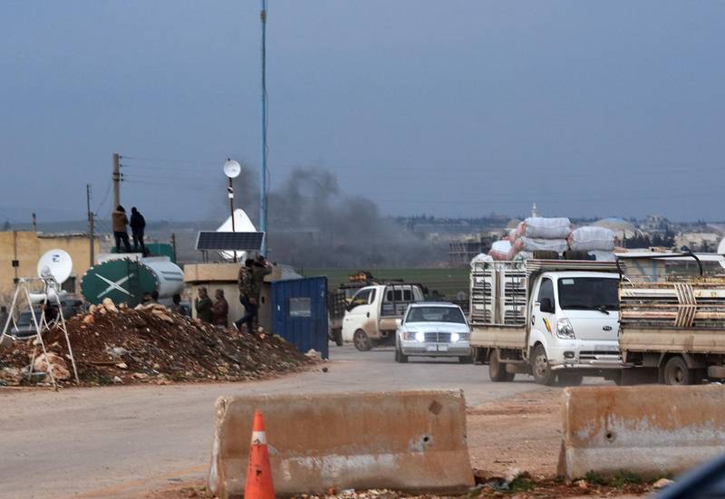 Vehicles evacuating following Turkish artillery bombardment near the Afrin crossing in the northern Syrian region, after Syrian pro-government forces entered the region. George Ourfalian / AFP
