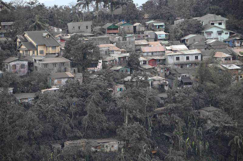 A general view of houses with roofs covered with ash, spewed by Taal volcano in Tagaytay city, south of Manila.  AFP