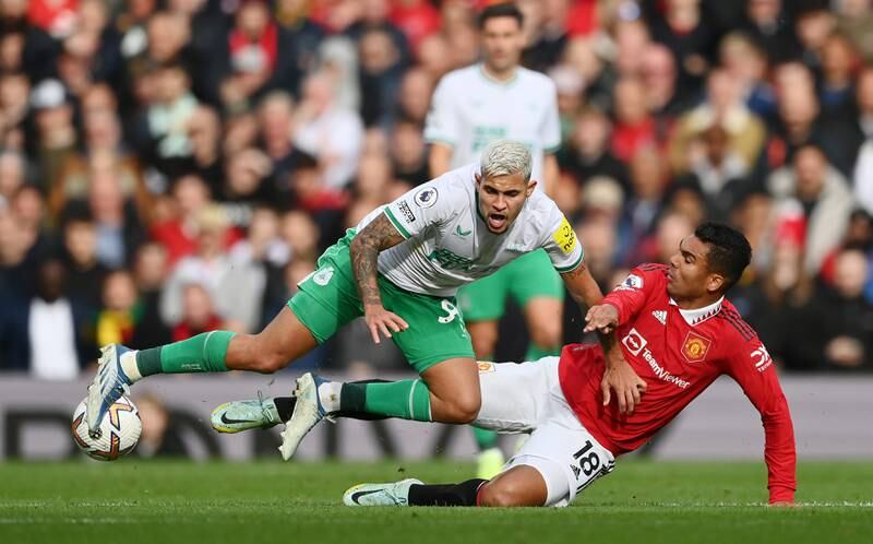 Newcastle midfielder Bruno Guimaraes is tackled by Casemiro of Manchester United. Getty