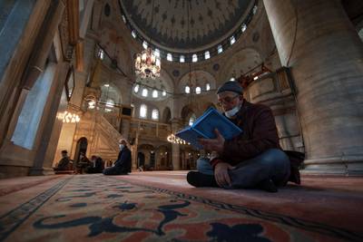People pray at the Eyup Sultan Mosque, in Istanbul a day before Ramadan. Turkey's President Recep Tayyip Erdogan was forced to announce renewed restrictions following a spike on COVID-19 cases, such as weekend lockdowns and the closure of cafes and restaurants during Ramadan, the holy Muslim month, starting on April 13. AP Photo