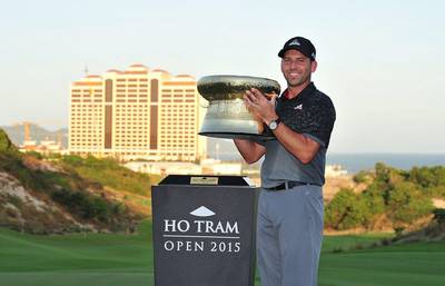 Sergio Garcia of Spain poses with the championship trophy after the final round of the of the Ho Tram Open in Ho Tram, Vietnam on December 6, 2015. AFP PHOTO / ASIAN TOUR / Khalid Redza
