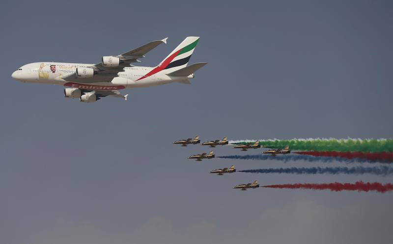 An Emirates Airline A-380 leads the "Al Fursan", or the Knights, a UAE Air Force aerobatic display team, during the opening day of the Dubai Air Show, United Arab Emirates, Sunday, Nov. 12, 2017. The biennial Dubai Air Show opened Sunday with hometown long-haul carrier Emirates making a $15.1 billion buy of American-made Boeing 787-10 Dreamliners, as the world's biggest defense companies promoted their weapons amid heightened tensions between Saudi Arabia and Iran. (AP Photo/Kamran Jebreili)