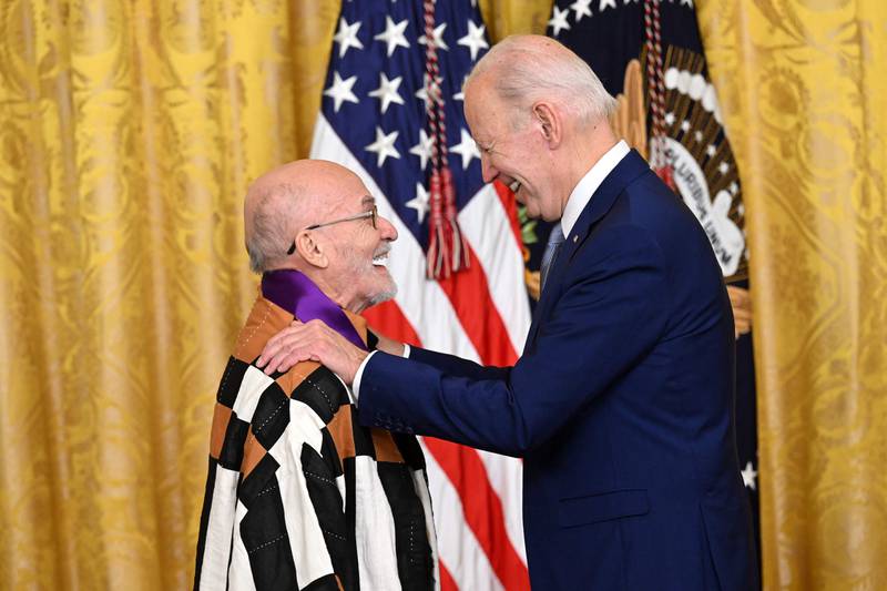 Mr Biden awards artist Antonio Martorell-Cardona with the 2021 National Medal of Arts. AFP