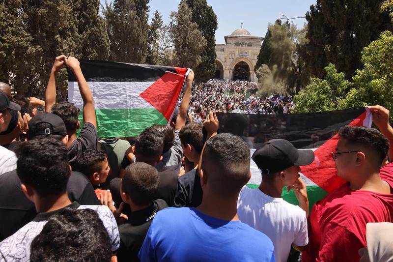 Palestinians protest at the Al Aqsa mosque compound in East Jerusalem over the death of Nizar Banat. AFP