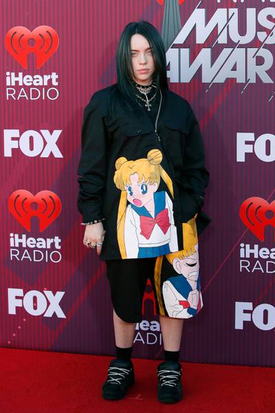 epa07439426 Billie Eilish arrives for the 2019 iHeartRadio Music Awards at the Microsoft Theater in Los Angeles, California, USA, 14 March 2019. The iHeartRadio Music Awards celebrates the most-played artists and songs on iHeartRadio stations and the iHeartRadio app throughout the previous year.  EPA-EFE/NINA PROMMER