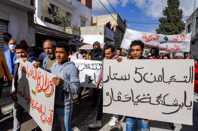 Protesters from the Ettadhamen city suburb on the northwestwern outskirts of Tunisia's capital Tunis march in a bid to pass onwards to reach an anti-government demonstration outside the Tunisian Assembly (parliament) headquarters. AFP