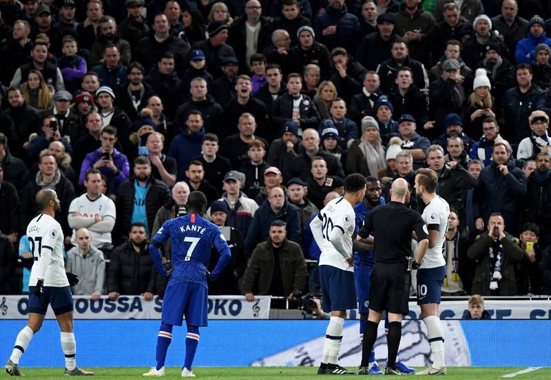 Referee Anthony Taylor speaks to Antonio Rudiger after the Chelsea player was racially abused by Spurs fans. EPA