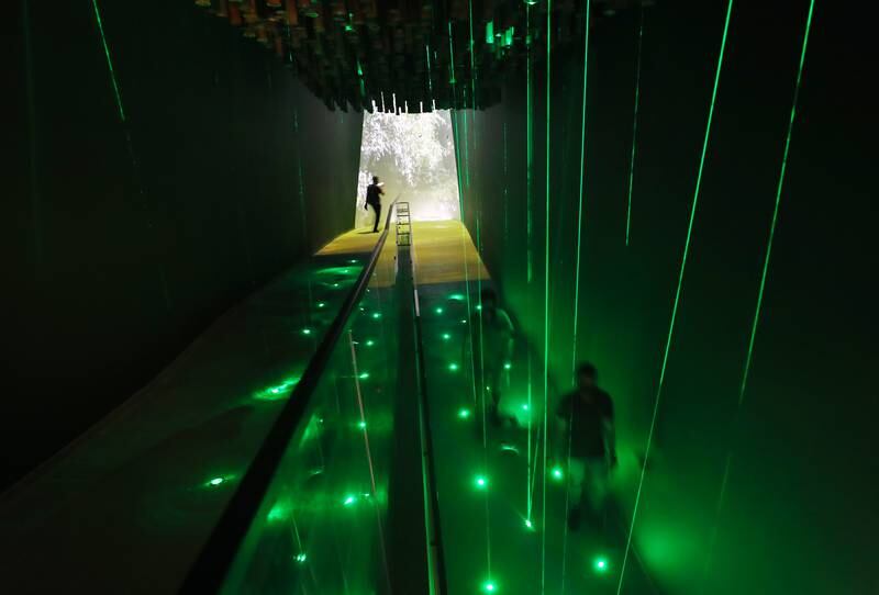 Green lights come off the floor and the ceiling in the Pakistan pavilion to do with the Billion trees project on the first day of Expo 2020 in Dubai. Chris Whiteoak / The National