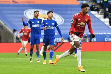 Manchester United's English striker Marcus Rashford (R) celebrates after scoring the opening goal during the English Premier League football match between Leicester City and Manchester United at King Power Stadium in Leicester, central England on December 26, 2020. RESTRICTED TO EDITORIAL USE. No use with unauthorized audio, video, data, fixture lists, club/league logos or 'live' services. Online in-match use limited to 120 images. An additional 40 images may be used in extra time. No video emulation. Social media in-match use limited to 120 images. An additional 40 images may be used in extra time. No use in betting publications, games or single club/league/player publications. / AFP / POOL / Glyn KIRK / RESTRICTED TO EDITORIAL USE. No use with unauthorized audio, video, data, fixture lists, club/league logos or 'live' services. Online in-match use limited to 120 images. An additional 40 images may be used in extra time. No video emulation. Social media in-match use limited to 120 images. An additional 40 images may be used in extra time. No use in betting publications, games or single club/league/player publications.