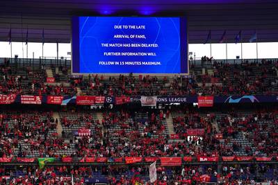 The giant screen showing that the kick-off has been depalyed due to late arriving fans. PA