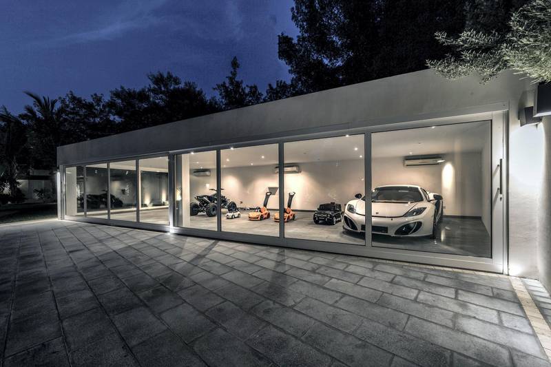 There's room for four full-sized cars in the showroom. All images courtesy LuxuryProperty.com
