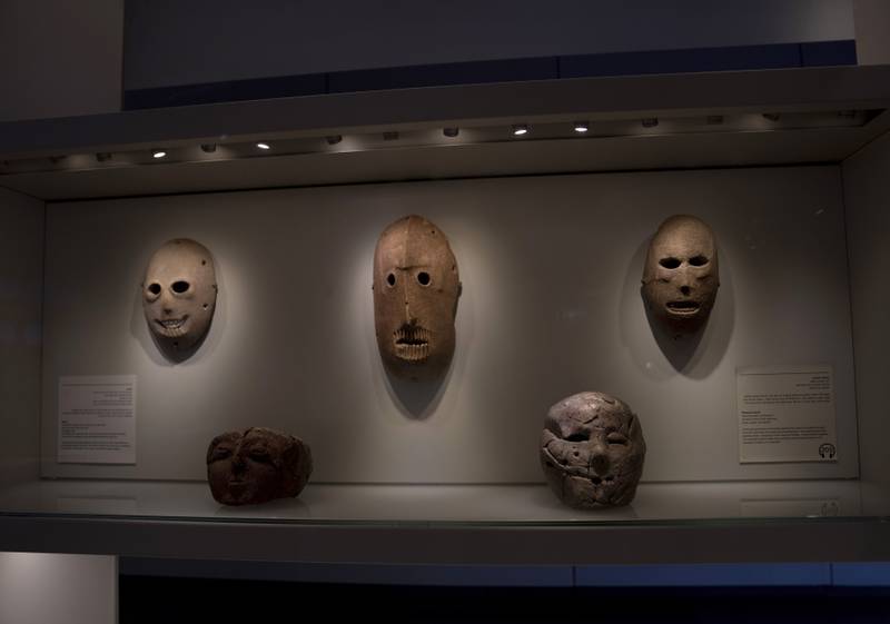 One of the masks in American billionaire Michael Steinhardt's collection, centre, is displayed at the Israel Museum in Jerusalem. AP