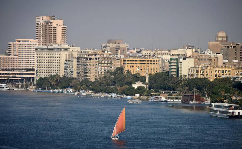 A general view shows a Felluca, a traditional Egyptian boat, sailing down Egypt's Nile river in Cairo, on December 23, 2014. AFP PHOTO / MOHAMED EL-SHAHED / AFP PHOTO / MOHAMED EL-SHAHED